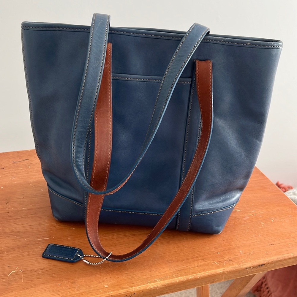 Vintage blue Coach bag. Gently used.  Water spot on bottom. Corners are good.